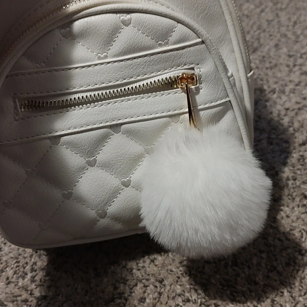Girls white backpack with Pom